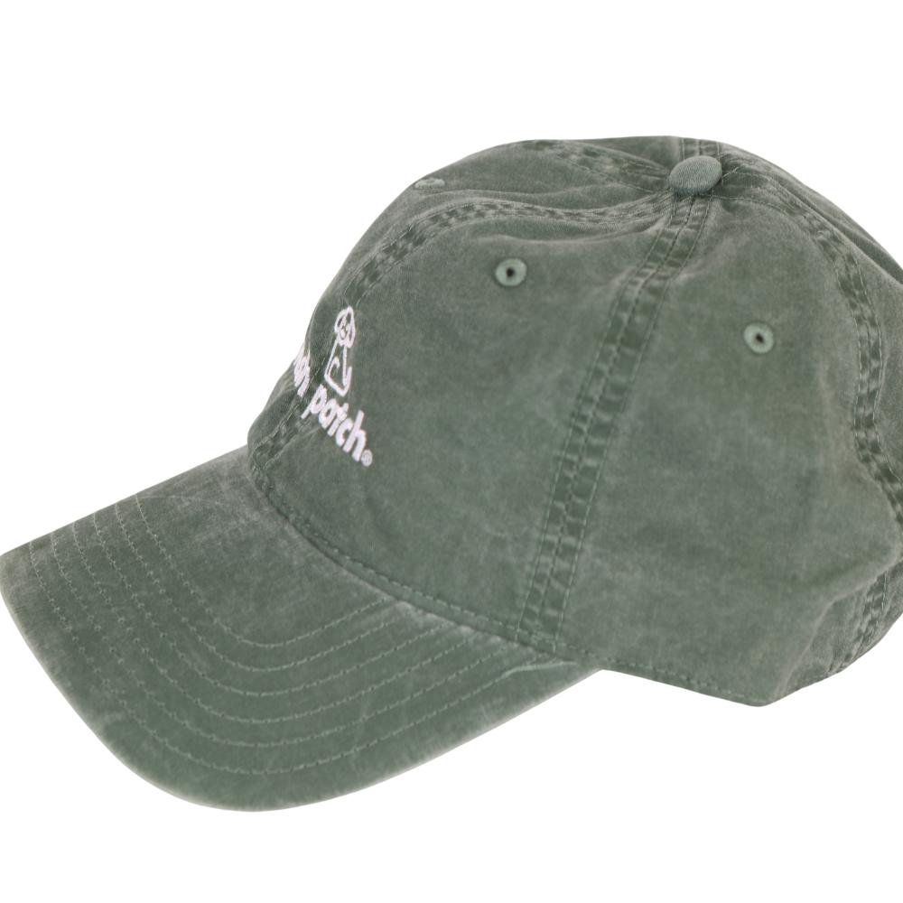 Side view of green baseball cap with 'fresh patch' branding