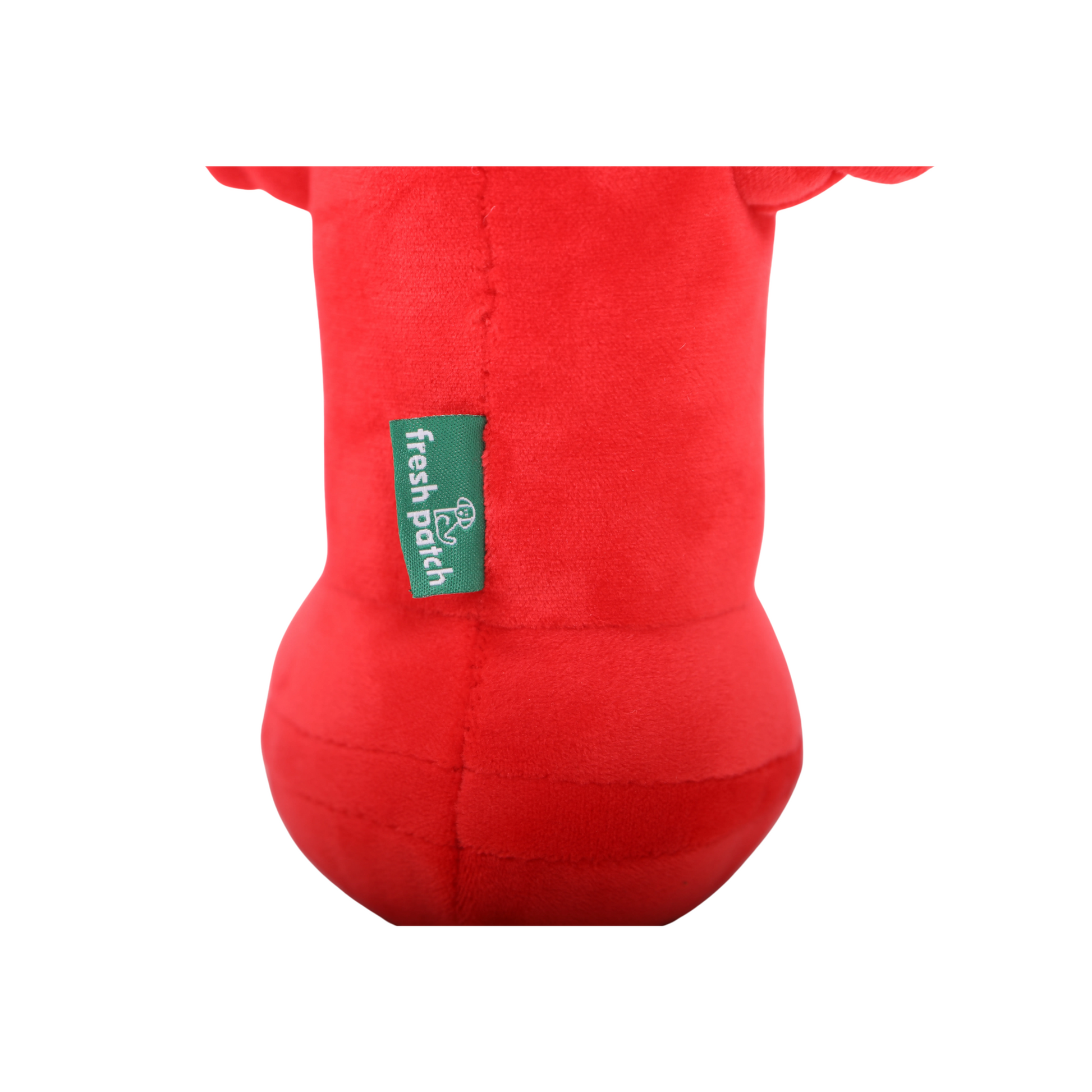 Close-up of bottom of red fire hydrant plush toy with a green 'fresh patch' label on a white background