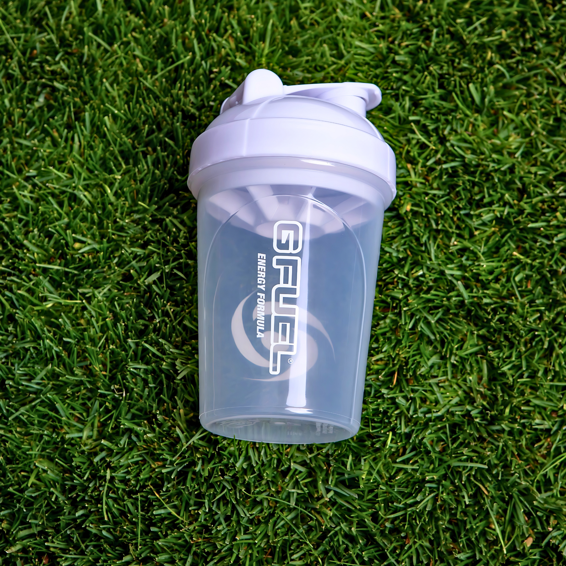 Clear G Fuel shaker cup on grass