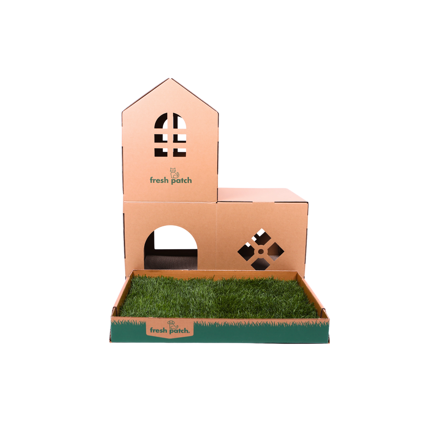 Cardboard cat house with grass patch inside a cardboard box on a white background