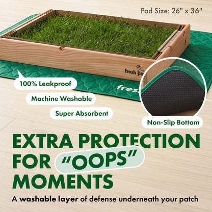 A Fresh Patch grass tray in a wooden frame sitting on a green quilted pad, with a close-up circle showing the pad's black textured underside. Text reads: Pad size: 26 by 36 inches. 100 percent leakproof. Machine washable. Super absorbent. Non-slip bottom. Extra protection for "oops" moments. A washable layer of defense underneath your patch.