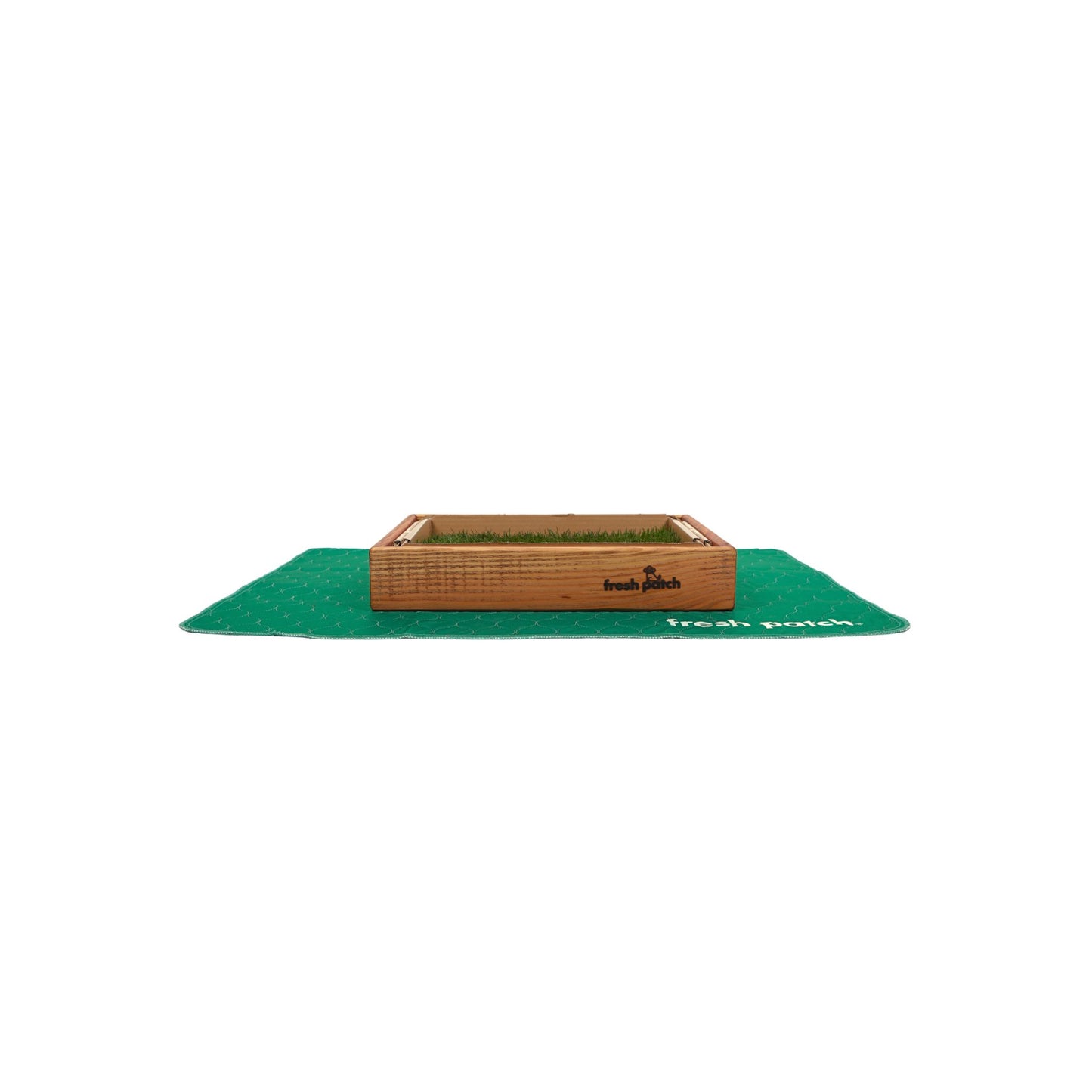 Green pad with a grass patch with a wooden border on a white background